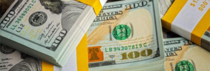 Cash Flow Management Skills Bundles of $100 bills.